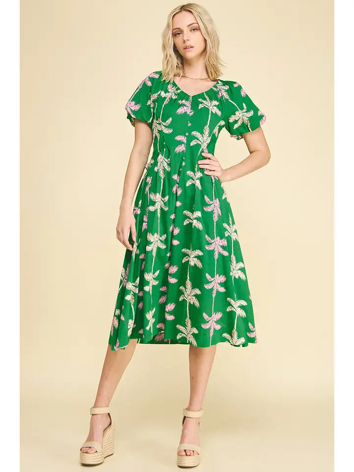 Green floral midi dress with short sleeves on model